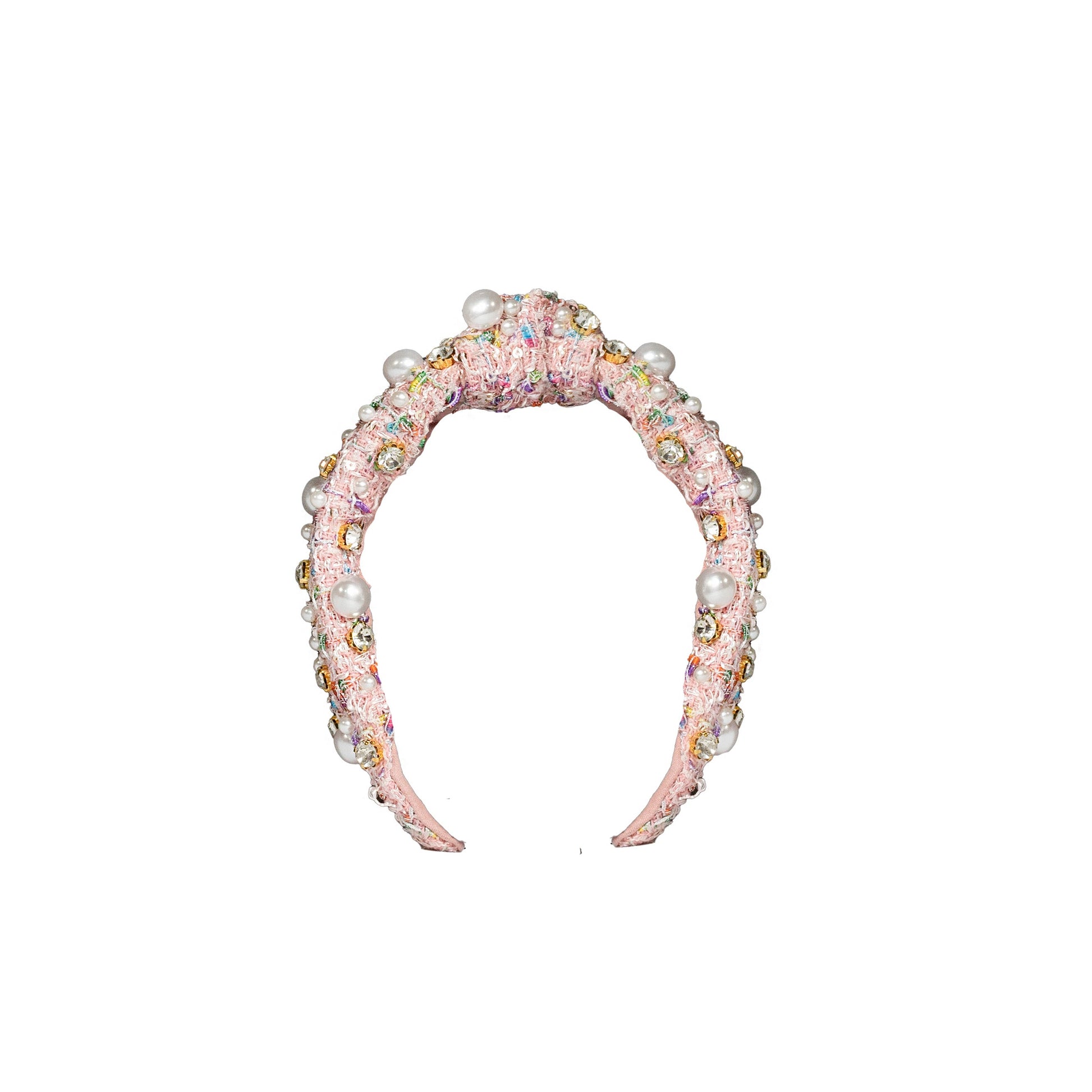 Decorative headband with pearls and crystals on a white background